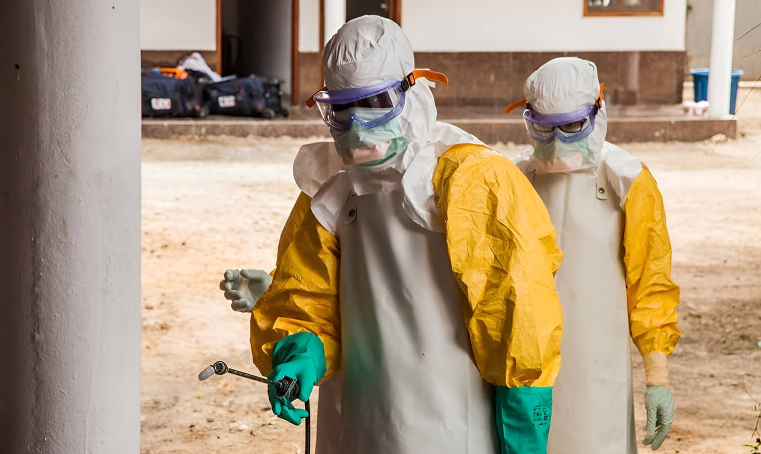 Workers on hazmat suits