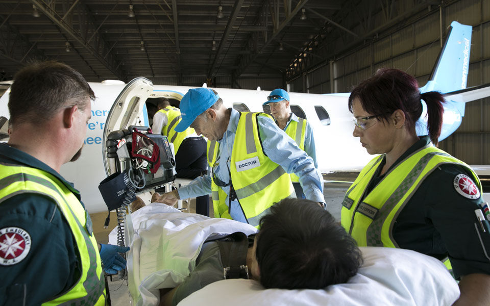 Photo of Aspen Medical team loading patient onto our aircraft.