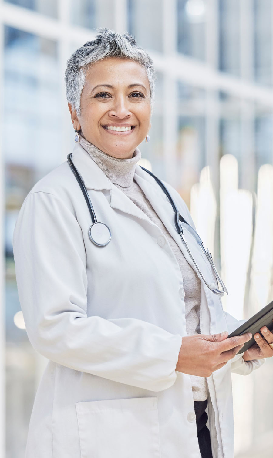 Photo of a professional healthcare worker holding an ipad.