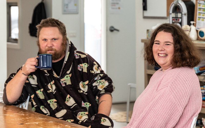 Photo of two Project Independence homeowners in their home.