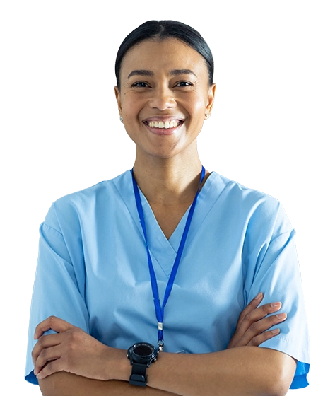 Photo shows a young female clinician wearing blue scrubs, smiling and crossing her arms.