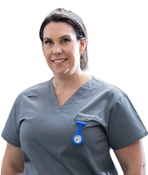 Photo shows a female Aspen Medical clinician with dark hair wearing grey scrubs.