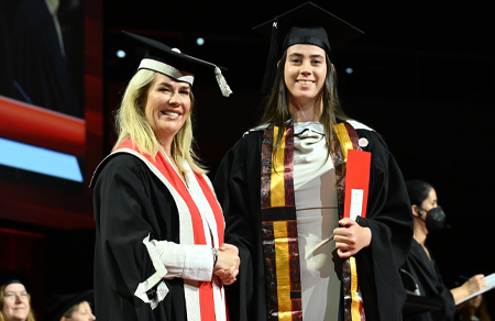 Photo shows a scholarship recipient graduating from university.