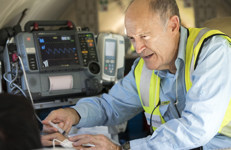 Photo shows an Aspen Medical clinician onboard our aircraft.