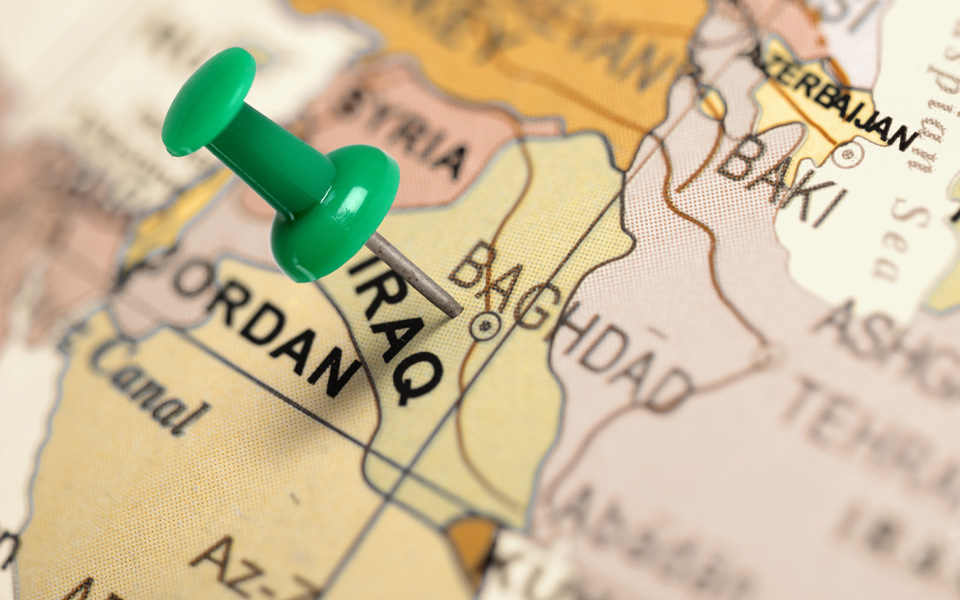 Image of a green pin on a map, indicating the location of Iraq.
