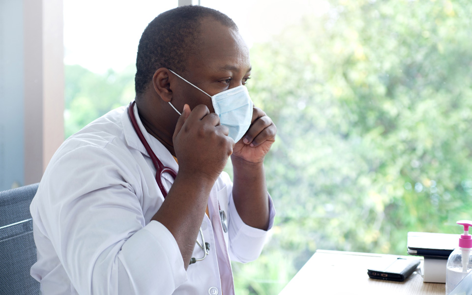 Image of a PNG doctor wearing medical mask on face, concept of prevention of COVID-19 infection, the coronavirus epidemic.