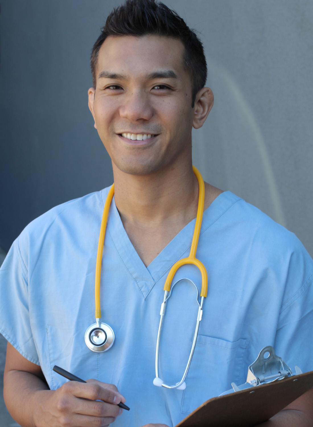 Image shows a young, male healthcare worker.