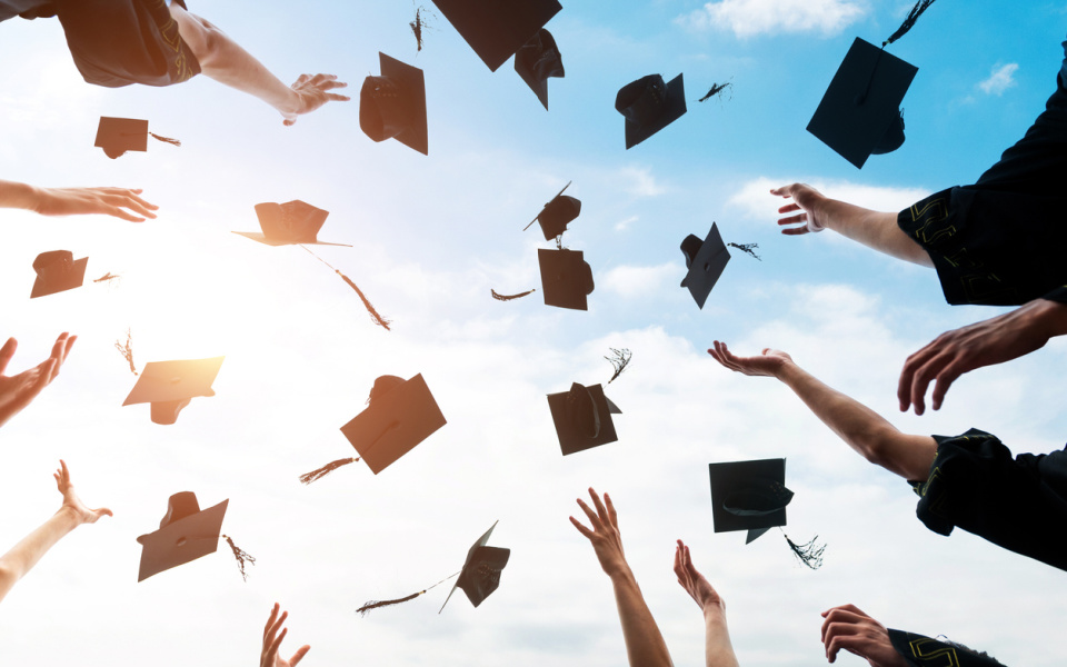 Stock image of graduation caps