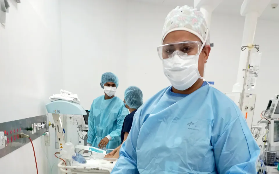 Nurse in surgical gown in operating theatre