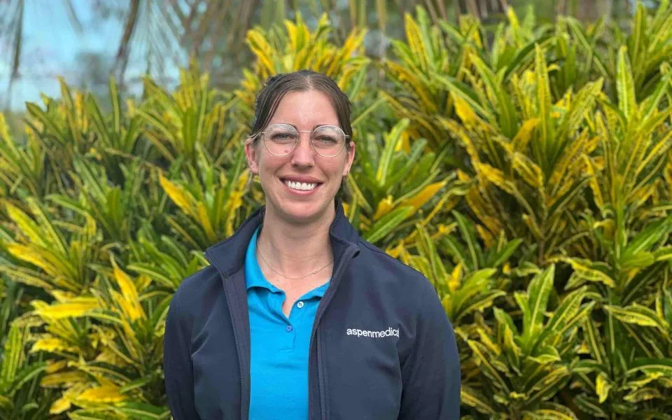Woman in Aspen Medical branded uniform 