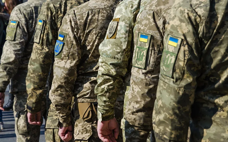 Ukrainian soldiers in uniform marching 