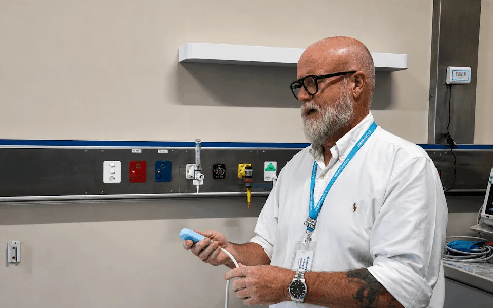 Man in hospital testing a Nurse Call System 